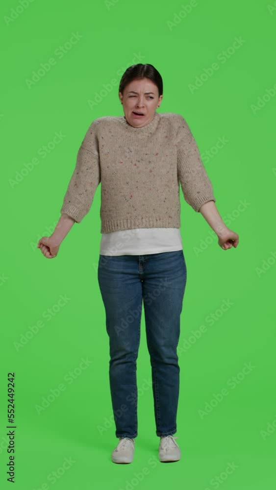 Vertical video: Front view of tired model yawning on studio camera, posing over green screen backdrop. Young adult being exhausted and sleepy standing over isolated full body greenscreen background Vertical video: Front view of tired model yawning on studio camera, posing over green screen backdrop. Young adult being exhausted and sleepy standing over isolated full body greenscreen background