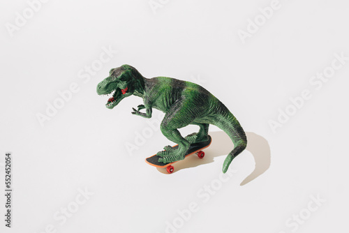 Tyrannosaurus rex on skateboard. White background. © Lazarevic Photoworks