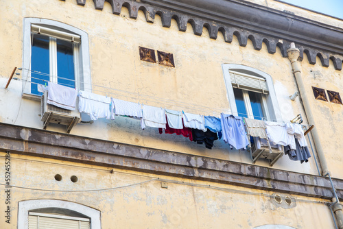 Things are dried on a rope through the window. Typical drying of clothes in the South of Italy
