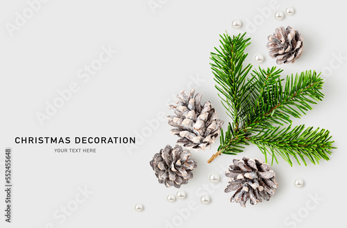 Christmas decoration. Fir tree branch, pine cone and pearls