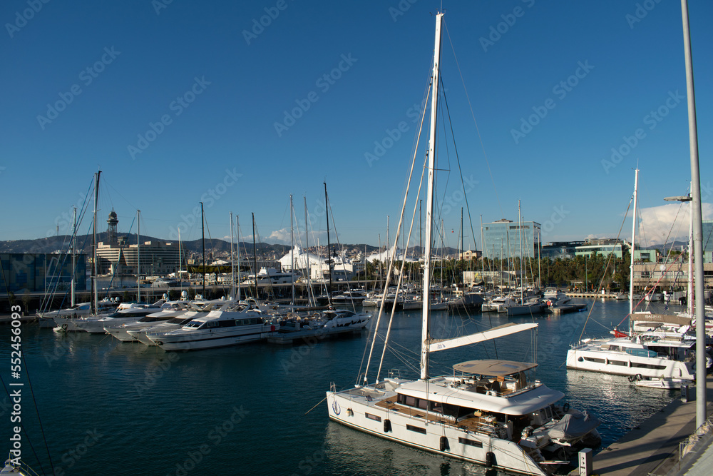 Boats and yachts moored in the harbor bay on a calm winter day