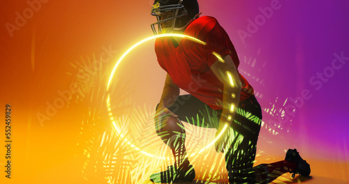Composite of american football player wearing helmet with ball kneeling by circle and plants