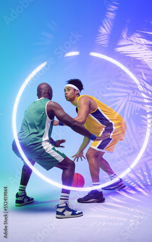 African american basketball players dribbling ball by illuminated plants and circle, copy space