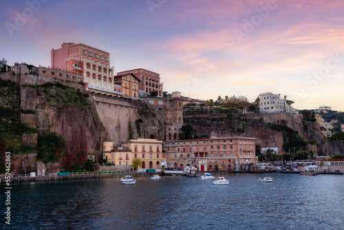 Homes and Hotels in a touristic town on the seafront. Sorrento, Compania, Italy. Colorful Sunrise Sky Art Render.