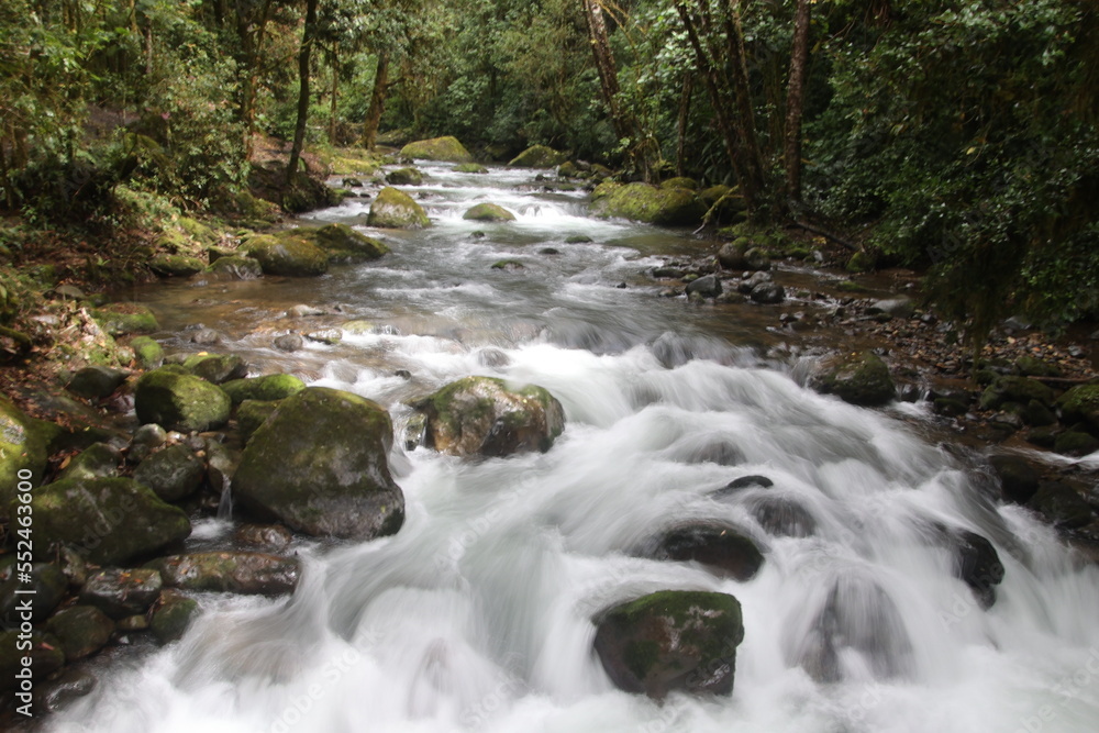 a waterfall surrounded in slow motion