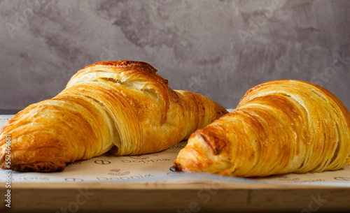 the best two croissants on the worl with a black background