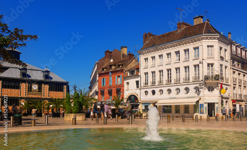 Cityscape of old French town of Sens with shops and outdoors cafe at summer photo