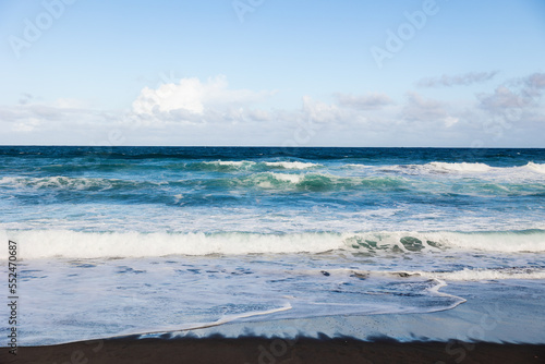 Atlantic ocean, waves and sand, good weather, Azores islands.