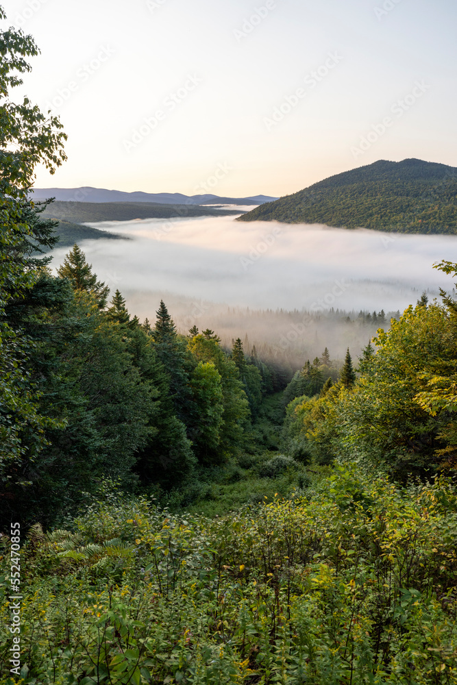 Mist covers the valley along the Maine Quebec international border
