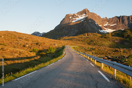 Kitind mountain peak over rural road, Lofoten Islands, Norway photo