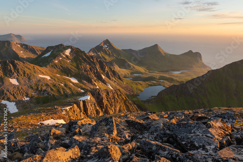 Midnight sun mountain landscape of Flakstadøy, Lofoten Islands, Norway