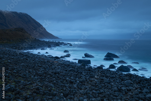 Waves flow over rocky coastline at Eggum, Lofoten Islands, Norway photo