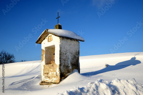 A village shrine and a shadow in the snow © FotoRugenwaldeFX