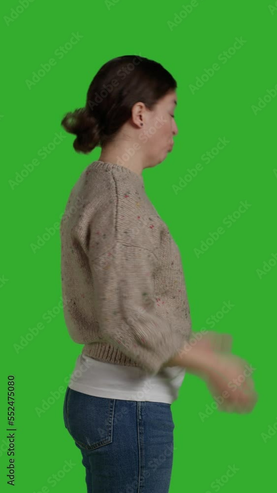 Vertical video: Profile of frustrated woman being mad and upset on isolated copyspace, acting furious and displeased in studio. Young person in conflict showing disagreement and disapproval, negative Vertical video: Profile of frustrated woman being mad and upset on isolated copyspace, acting furious and displeased in studio. Young person in conflict showing disagreement and disapproval, negative
