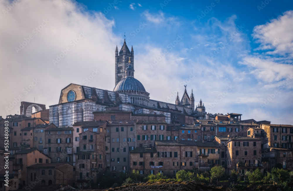 Beautiful panoramic view of the historic city of Siena at the morning with an amazing cloudscape on an idyllic autumn evening, Tuscany, Italy. October 2022