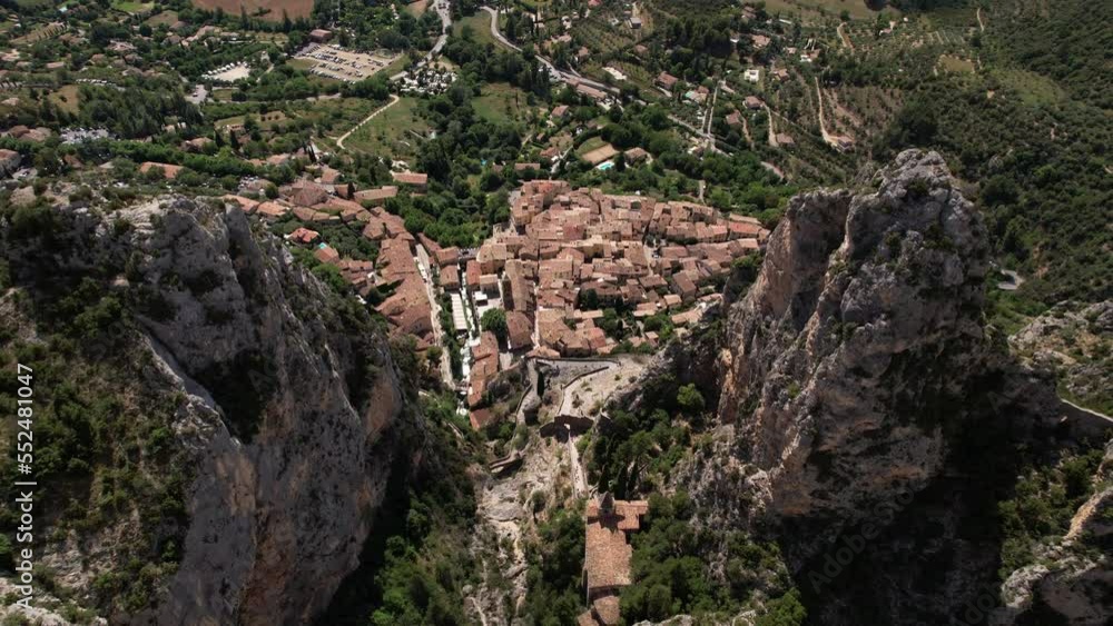 The village of Moustiers-Sainte-Marie, seen from above the limestone cliff The village of Moustiers-Sainte-Marie, seen from above the limestone cliff