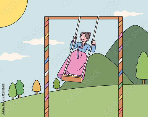 Korean traditional swing. A girl wearing a hanbok is standing on a high hanging swing.