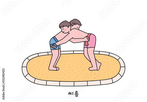 Korean traditional sport Ssireum. Two wrestlers are wrestling on the sand.