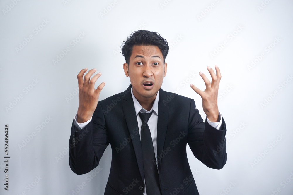 Angry man gesturing angrily raising hands and shouting loudly expressing anger after quarrel with boss or employee in suit isolated over white background. Feel my anger Angry man gesturing angrily raising hands and shouting loudly expressing anger after quarrel with boss or employee in suit isolated over white background. Feel my anger