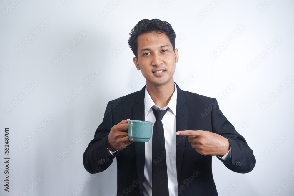 Young Business Man Drinking a Cup of Coffee or Tea Young Business Man Drinking a Cup of Coffee or Tea