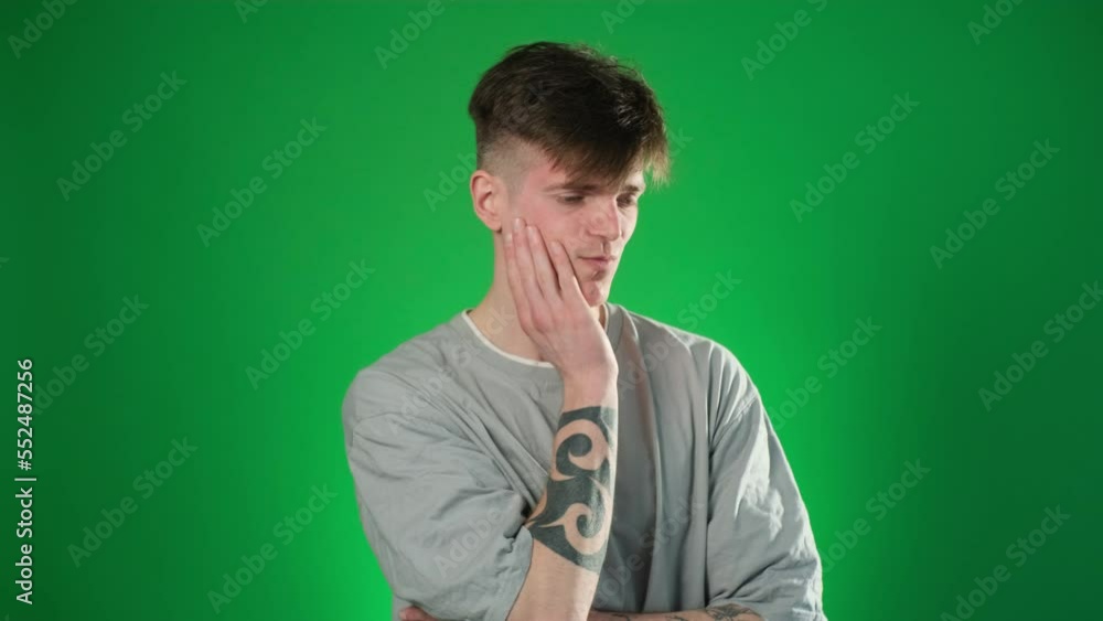 Portrait of young guy suffering from tooth pain Portrait of young guy suffering from tooth pain