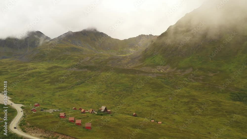 Aerial shot of picturesque red house in Hatcher pass, Alaska Aerial shot of picturesque red house in Hatcher pass, Alaska