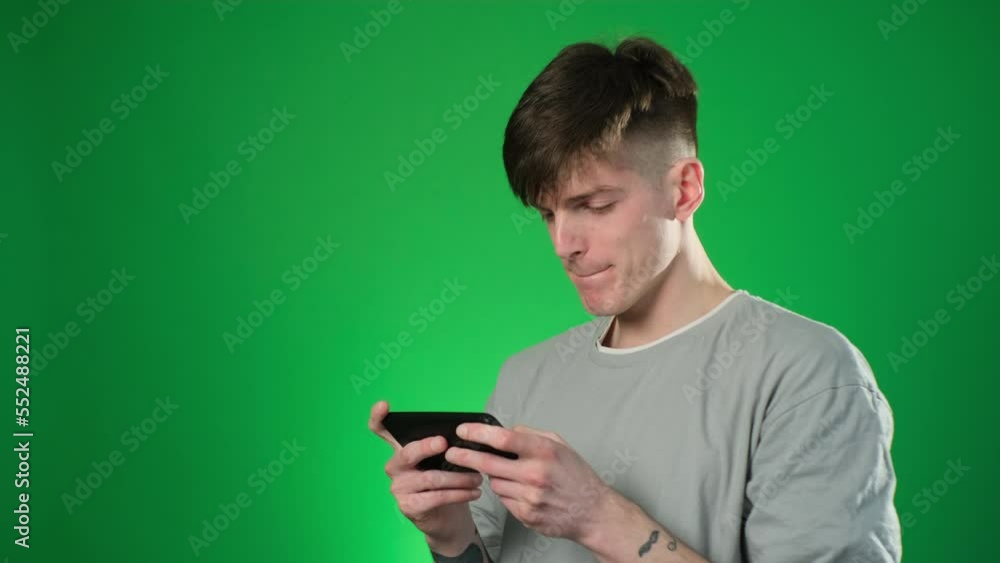 Man in gray t-sirt playing video games and winning Man in gray t-sirt playing video games and winning