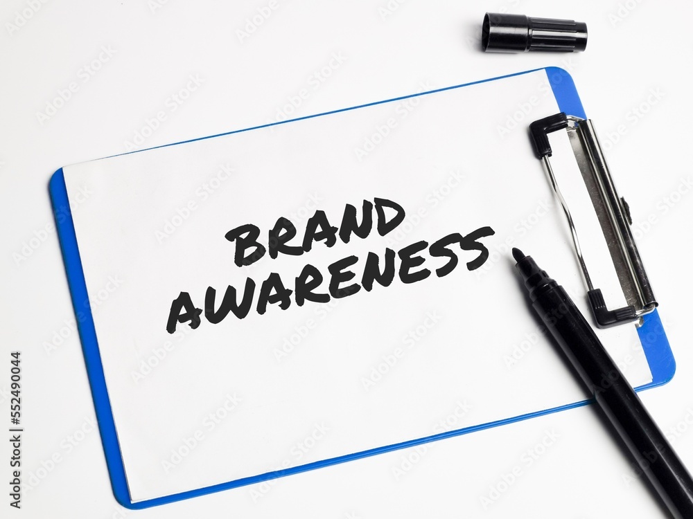Brand awareness written on paper clipboard isolated on white background.