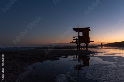 Obraz na płótnie A lifeguard stand on the beach by the sea at dusk almost at night, in Pinamar, Buenos Aires, Argentina w salonie