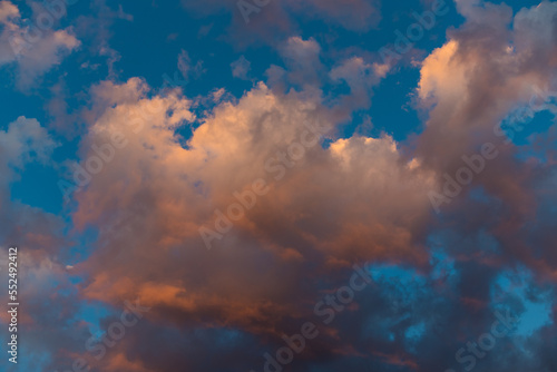 Sky background of dramatic sunset with pink and purple storm clouds
