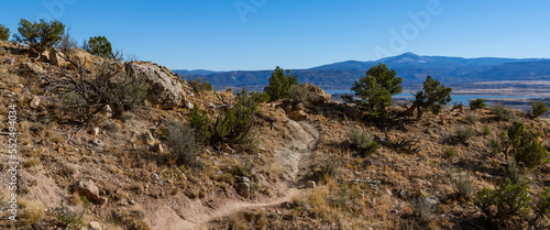 Panorama of Chimney Rock Trail and desert landscape at Ghost Ranch