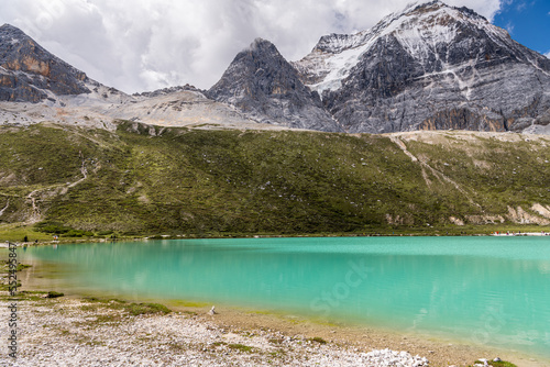 The shores of the Milk Lake in Daocheng Yading, Sichuan, China. Daocheng Yading is one of the most intact and primitive alpine natural ecosystems in China and is the core of the Shangri-La Ecotourism 