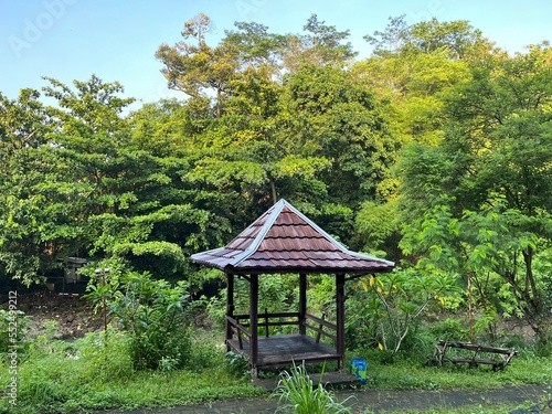 A wooden gazebo surrounded by tree in Lava Bantal River Yogyakarta, Indonesia.