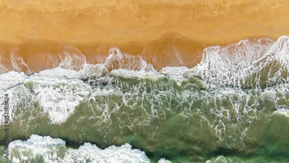 Waves sea texture lapping across untouched shore. Drone aerial view landscape. Waves sea texture lapping across untouched shore. Drone aerial view landscape.