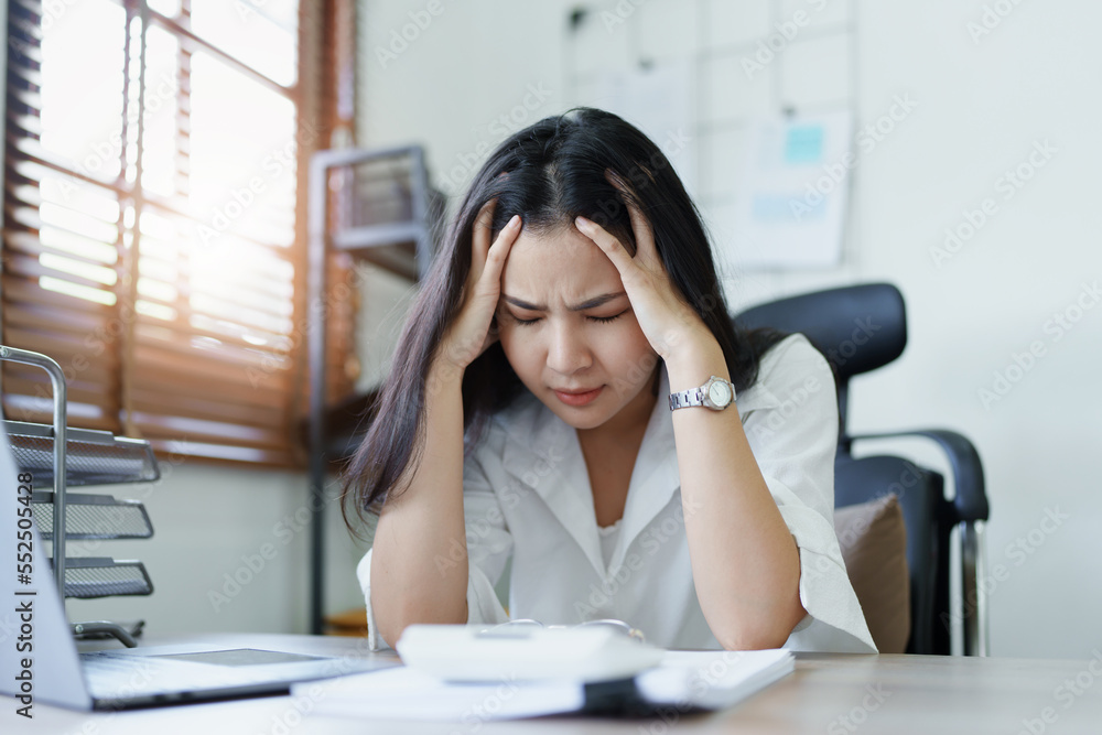 Portrait of sme business owner, woman using computer and financial statements Anxious expression on expanding the market to increase the ability to invest in business Portrait of sme business owner, woman using computer and financial statements Anxious expression on expanding the market to increase the ability to invest in business