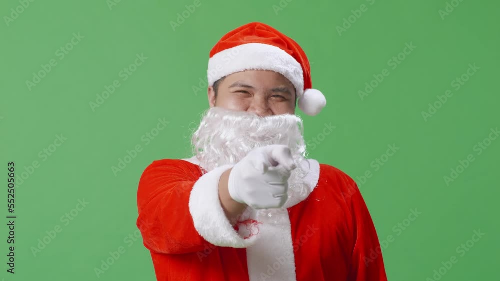 Close Up Of Asian Santa Claus Pointing To Camera On Green Screen Background In The Studio
Close Up Of Asian Santa Claus Pointing To Camera On Green Screen Background In The Studio