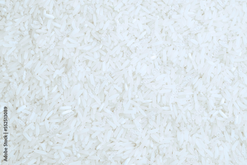 White uncooked milled rice as a background. Top view. White uncooked milled rice as a background. Top view.