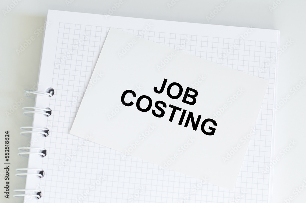 A card with text JOB COSTING on the table A card with text JOB COSTING on the table
