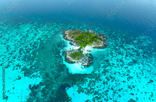 The tropical with seashore island in a coral reef ,blue and turquoise sea Amazing nature landscape with blue lagoon-Above view © SASITHORN