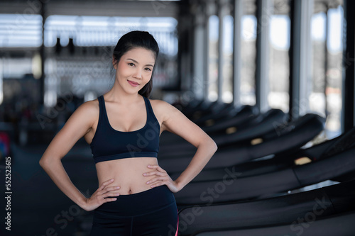 Close up asian beautiful sportswoman wear sport bra on wall of gym,Thailand love health,Slim woman workout concept
