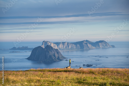 Hiker on Hellsegga plateau, Lofoten Islands, Norway photo