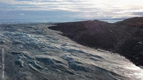 Aerial view over the icecap at pinot 660, just outside Kangerlussuaq, Greenland. Pull out, booming up.
