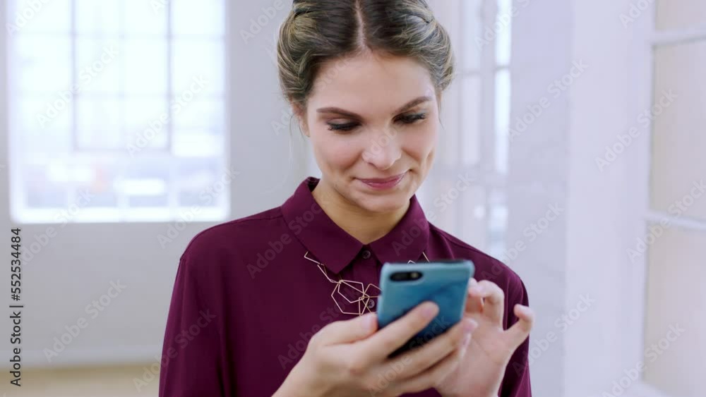 Phone, office and creative woman networking or scrolling on social media, mobile app or the internet. Technology, professional and female marketing employee browsing on her mobile device in workplace