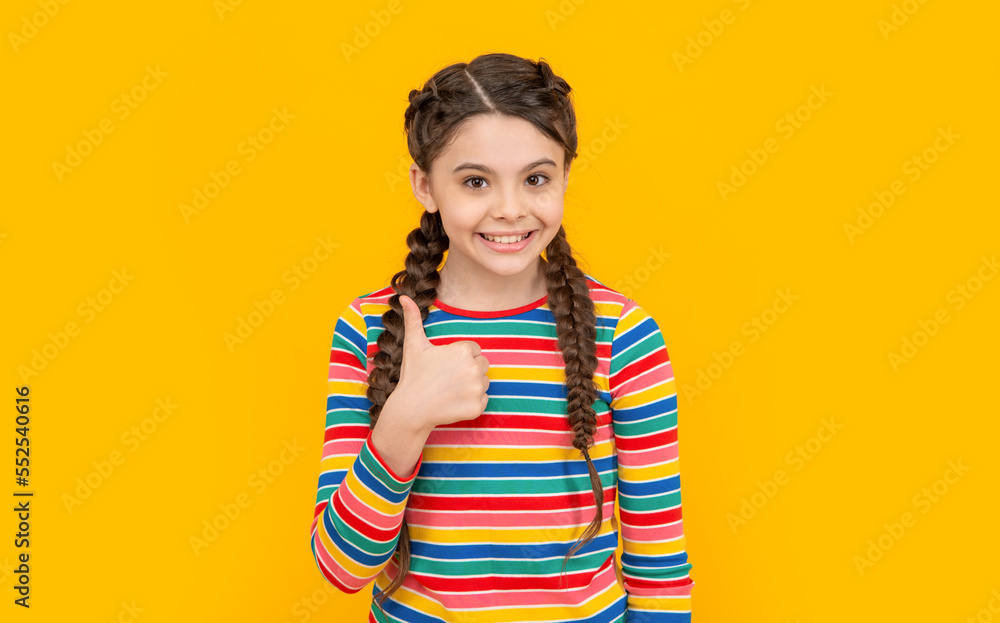 photo of teen girl show thumb up. childhood studio shot of teen girl. concept of childhood. photo of teen girl show thumb up. childhood studio shot of teen girl. concept of childhood.