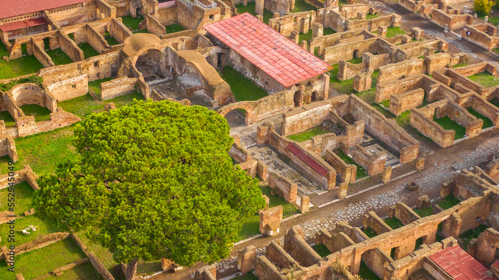 Fototapeta premium Aerial view on the house of the envious in Ostia Antica. It is so called for a mosaic at the entrance. The archaeological area is located in Rome, Italy. 