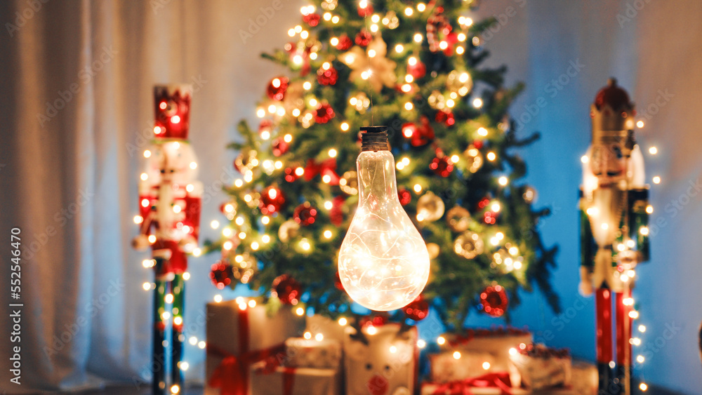 Swinging Lamp Against The Christmas Tree lights