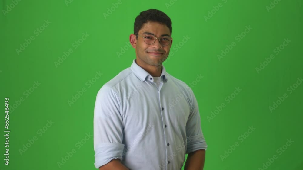 Mixed Race Man Smiling Against Green Background, Gesturing Thumbs-up And Clapping Hands. medium shot Mixed Race Man Smiling Against Green Background, Gesturing Thumbs-up And Clapping Hands. medium shot