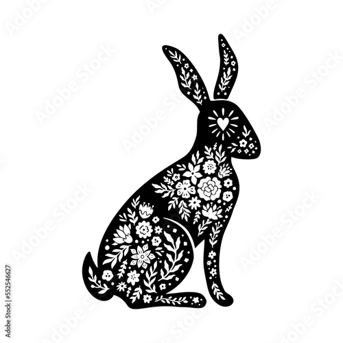 Easter floral rabbit silhouette in linocut style. Cute bunny shape, flower, leaves. Vector folk art illustration isolated on white background. Bloom linocut rabbit icon for logo, social media, print.