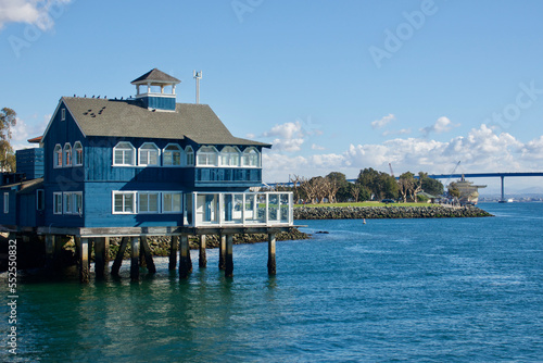vintage waterfront building built on pylons in the harbor © Heidi Patricola