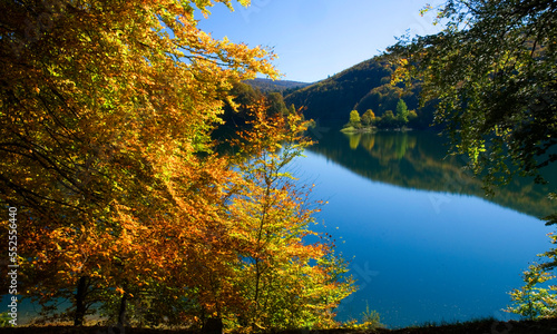 Fototapeta Naklejka Na Ścianę i Meble -  Irabia reservoir in the Irati forest with fall colors. Navarre. Spain